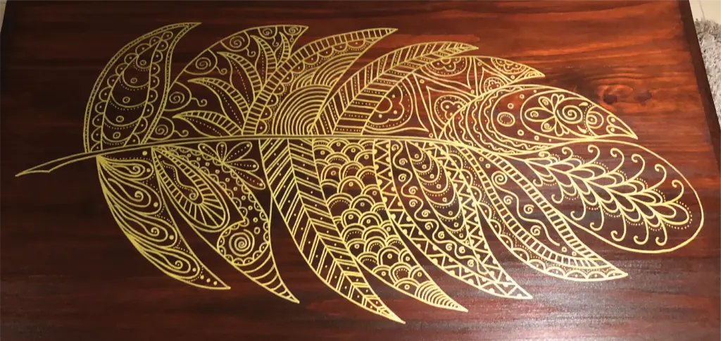 hand drawn artwork on stained wood furniture